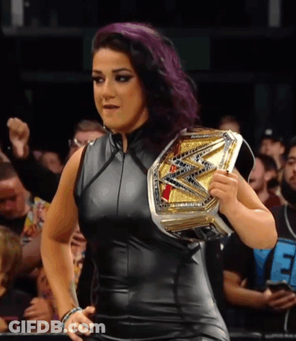Woman With Purple Hair Holding Wrestling Championship Belt GIF