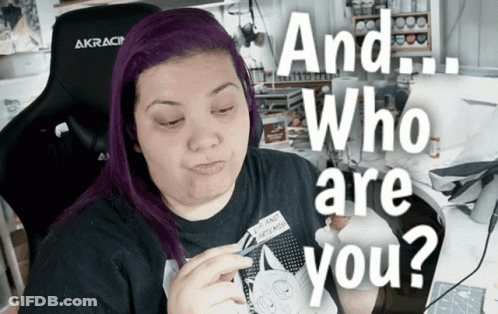 Woman With Purple Hair In AKRacing Chair Asking Who Are You GIF