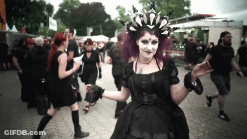 Woman With Purple Hair In Black Dress And Crown GIF