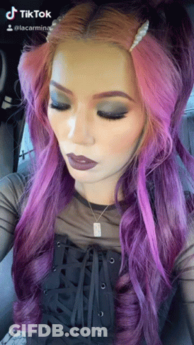 Woman With Purple Hair In Black Top And Necklace GIF