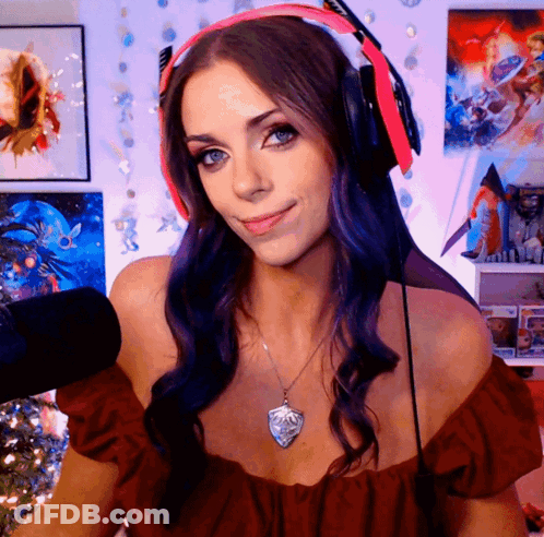 Woman With Purple Hair In Red Top And Headphones GIF