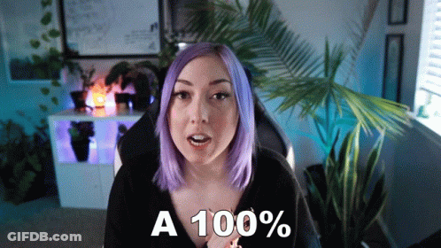 Woman With Purple Hair Saying A 100% In Front Of Palm Tree GIF