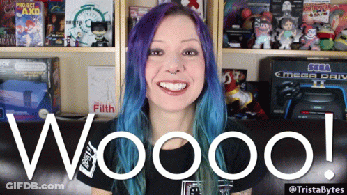 Woman With Purple Hair Saying Wooo In Front Of Sega Mega Drive GIF