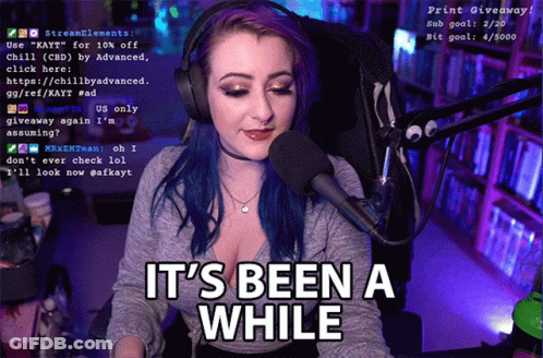 Woman With Purple Hair Sitting At Microphone GIF