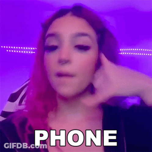 Woman With Purple Hair Sitting At Microphone GIF