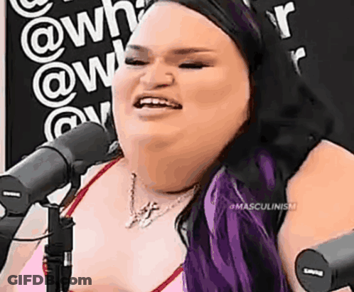 Woman With Purple Hair Smiling At Microphone GIF