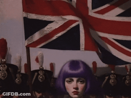 Woman With Purple Hair Standing In Front Of Soldiers GIF
