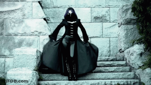 Woman With Purple Hair Standing On Steps GIF