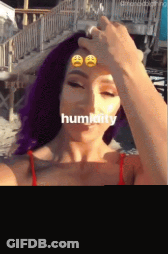 Woman With Purple Hair Taking Selfie GIF