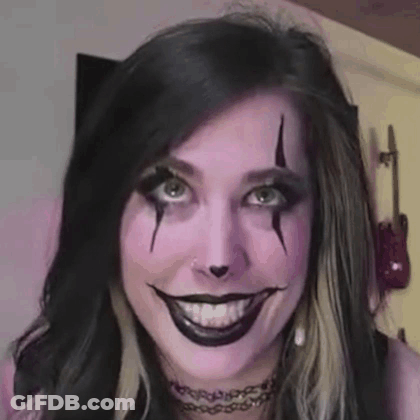 Woman With Purple Makeup Making Funny Face GIF