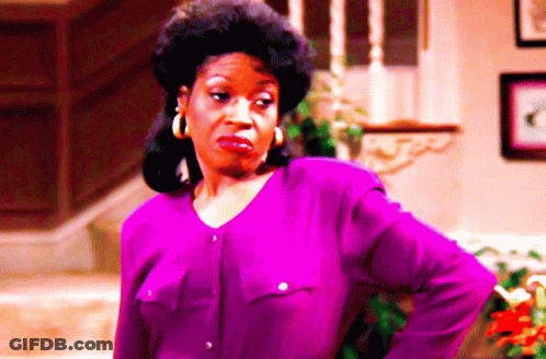 Woman With Purple Shirt And Hoop Earrings Funny Face GIF