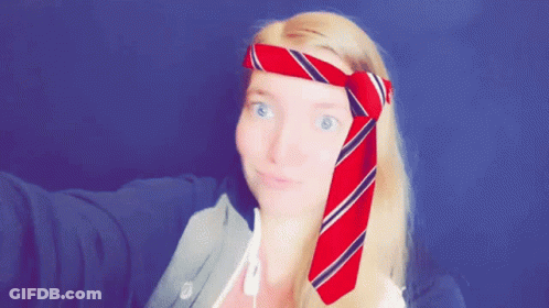 Woman With Red And Blue Striped Tie Around Head GIF