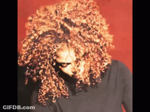 Woman With Red Curly Hair And Black Shirt GIF