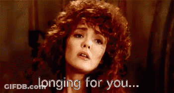 Woman With Red Curly Hair Longing For You GIF