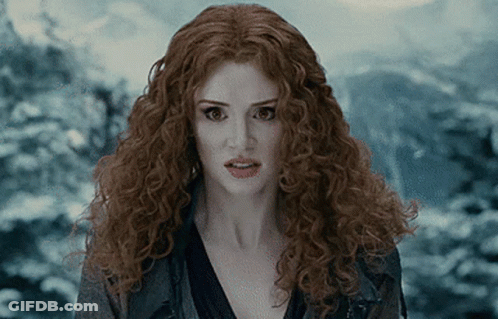 Woman With Red Curly Hair Surprised Looking At Camera GIF