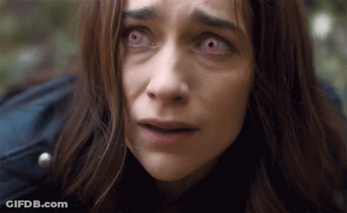 Woman With Red Eyes Looking At Camera GIF