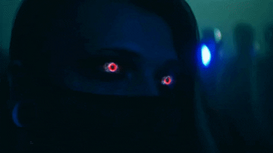 Woman With Red Eyes Wearing Face Mask GIF