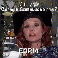 Woman With Red Hair And Black Hat Holding Paper In Front Of Face GIF