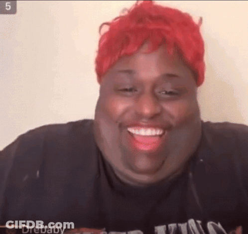 Woman With Red Hair And Black Shirt Smiling GIF