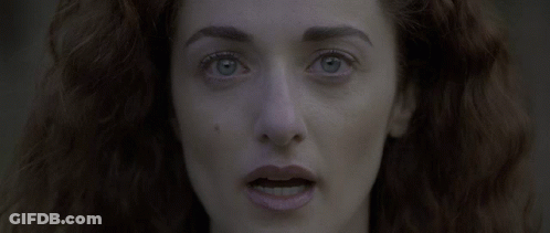 Woman With Red Hair And Blue Eyes Close Up GIF