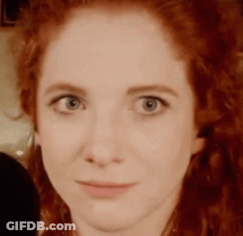 Woman With Red Hair And Blue Eyes GIF