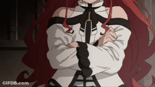 Woman With Red Hair And Crossed Arms GIF