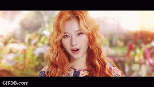 Woman With Red Hair And Floral Dress GIF