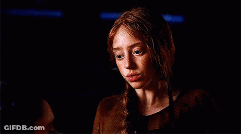 Woman With Red Hair And Freckles In Dark Room With Man GIF