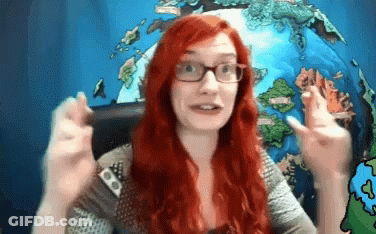 Woman With Red Hair And Glasses Making Funny Face GIF