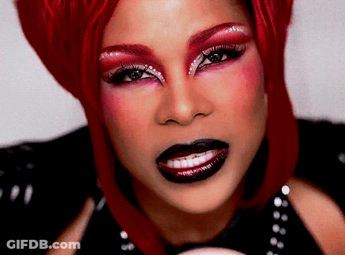 Woman With Red Hair And Makeup Close Up GIF