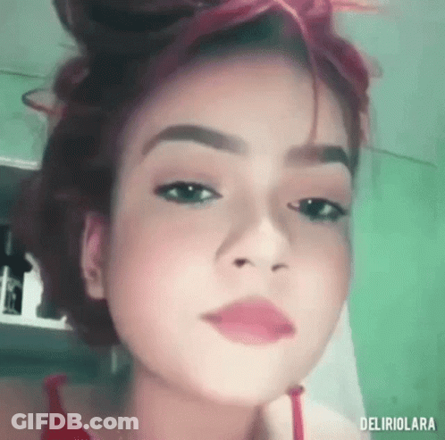 Woman With Red Hair And Red Shirt GIF