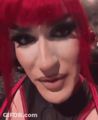 Woman With Red Hair Black Makeup Close Up GIF
