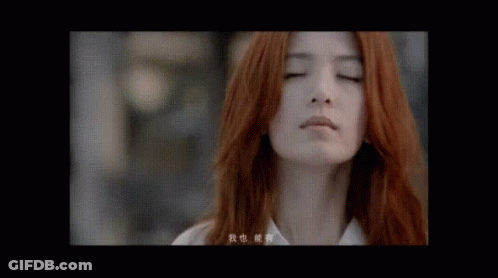 Woman With Red Hair Close Up GIF