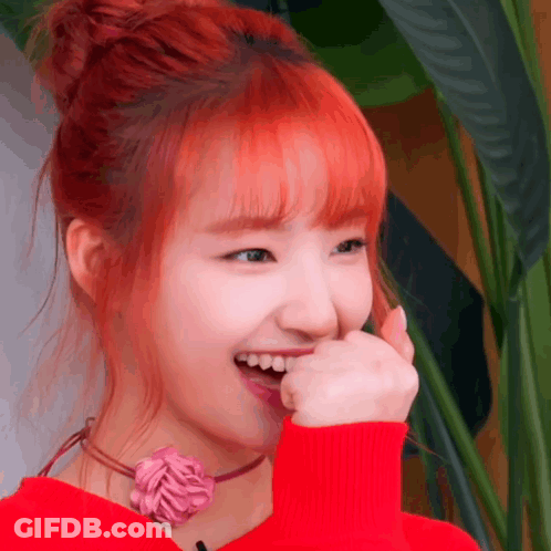 Woman With Red Hair Covering Mouth GIF