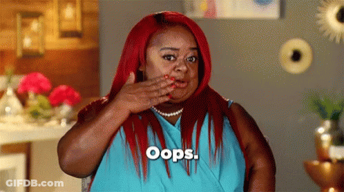 Woman With Red Hair Covering Mouth Oops GIF