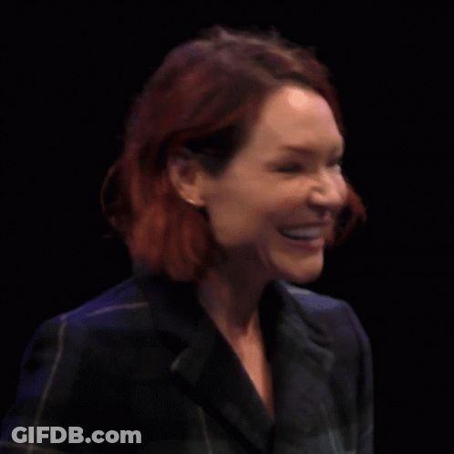 Woman With Red Hair Crosses Fingers GIF