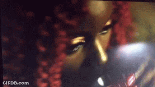Woman With Red Hair Drinking From Glass GIF