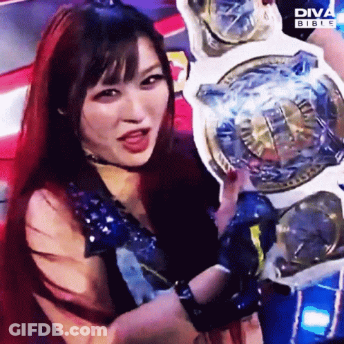 Woman With Red Hair Holding Diva Bible Championship Belt GIF
