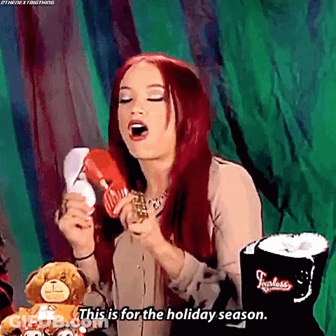 Woman With Red Hair Holding Stuffed Animal GIF