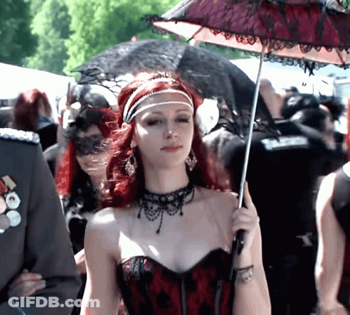 Woman With Red Hair Holding Umbrella GIF