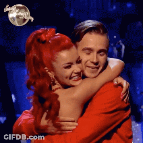 Woman With Red Hair Hugging Man GIF