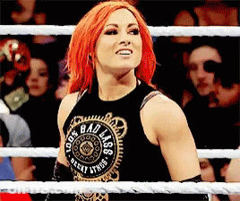 Woman With Red Hair In Black Tank Top Saying Bad Ass GIF
