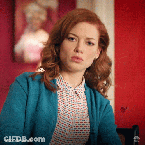 Woman With Red Hair In Blue Cardigan GIF
