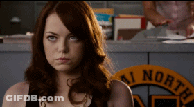 Woman With Red Hair In Front Of AI North Sign GIF