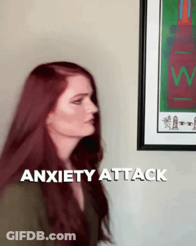 Woman With Red Hair In Front Of Anxiety Attack Sign GIF