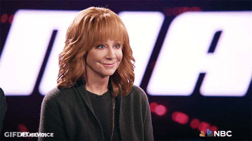Woman With Red Hair In Front Of NBC Logo GIF