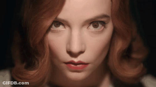 Woman With Red Hair In Green Knitted Hat Coughing GIF
