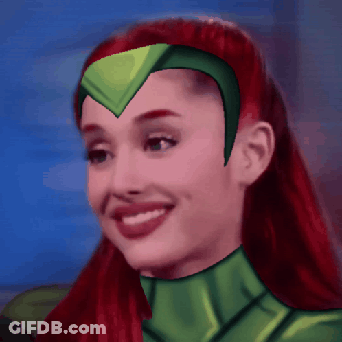 Woman With Red Hair In Green Superhero Costume GIF