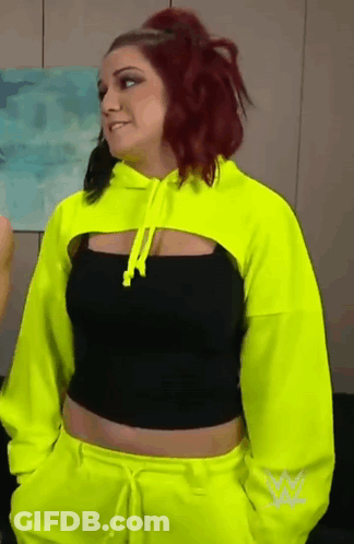 Woman With Red Hair In Neon Yellow Hoodie GIF