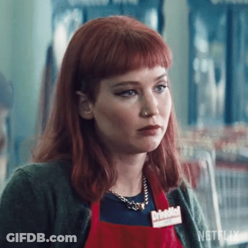 Woman With Red Hair In Red Apron And Necklace GIF